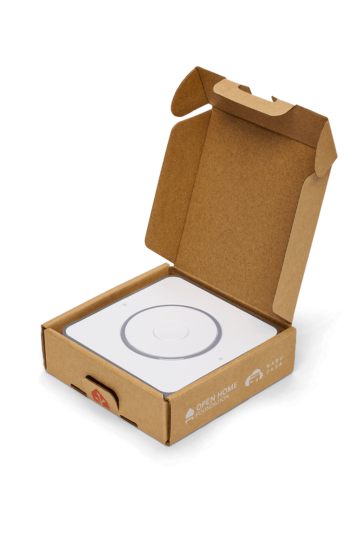 Geopende verpakking van de Home Assistant Voice preview, de bovenzijde van het apparaat is zichtbaar.