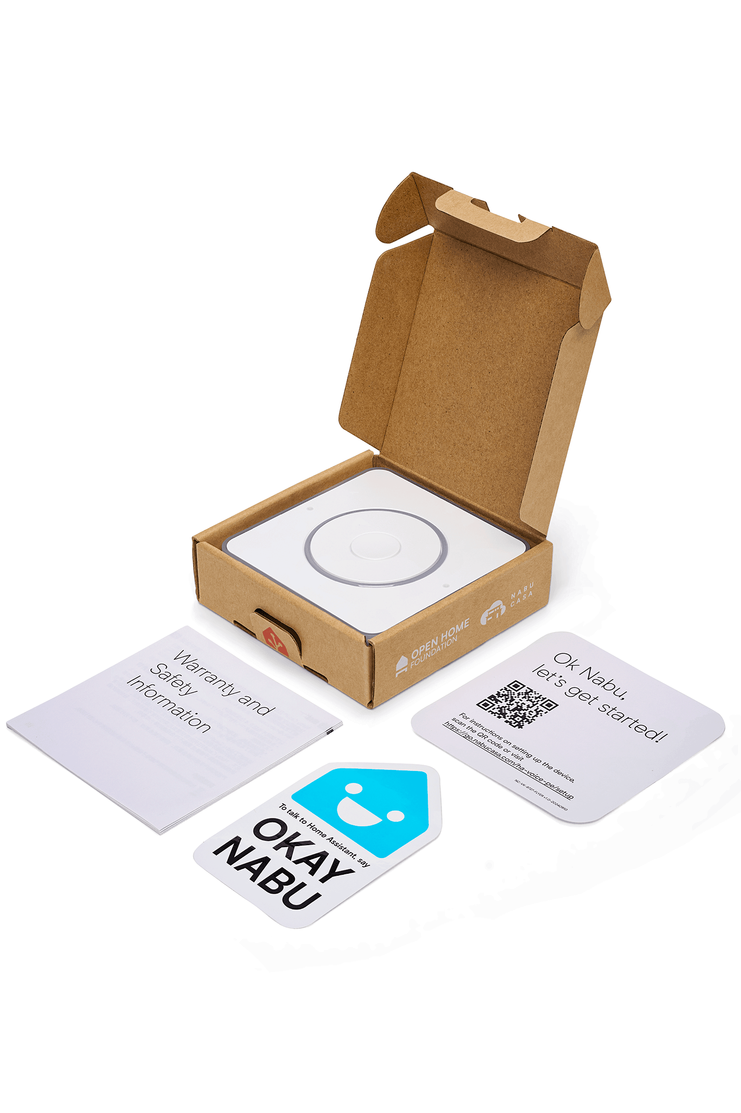 Kartonnen verpakking met erin de Home Assistant Voice preview, alle documentatie ligt naast de doos.